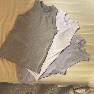 Athleta bundle of 3 ribbed, stretch,high neck tanks. Lavender,gray,white. Small
